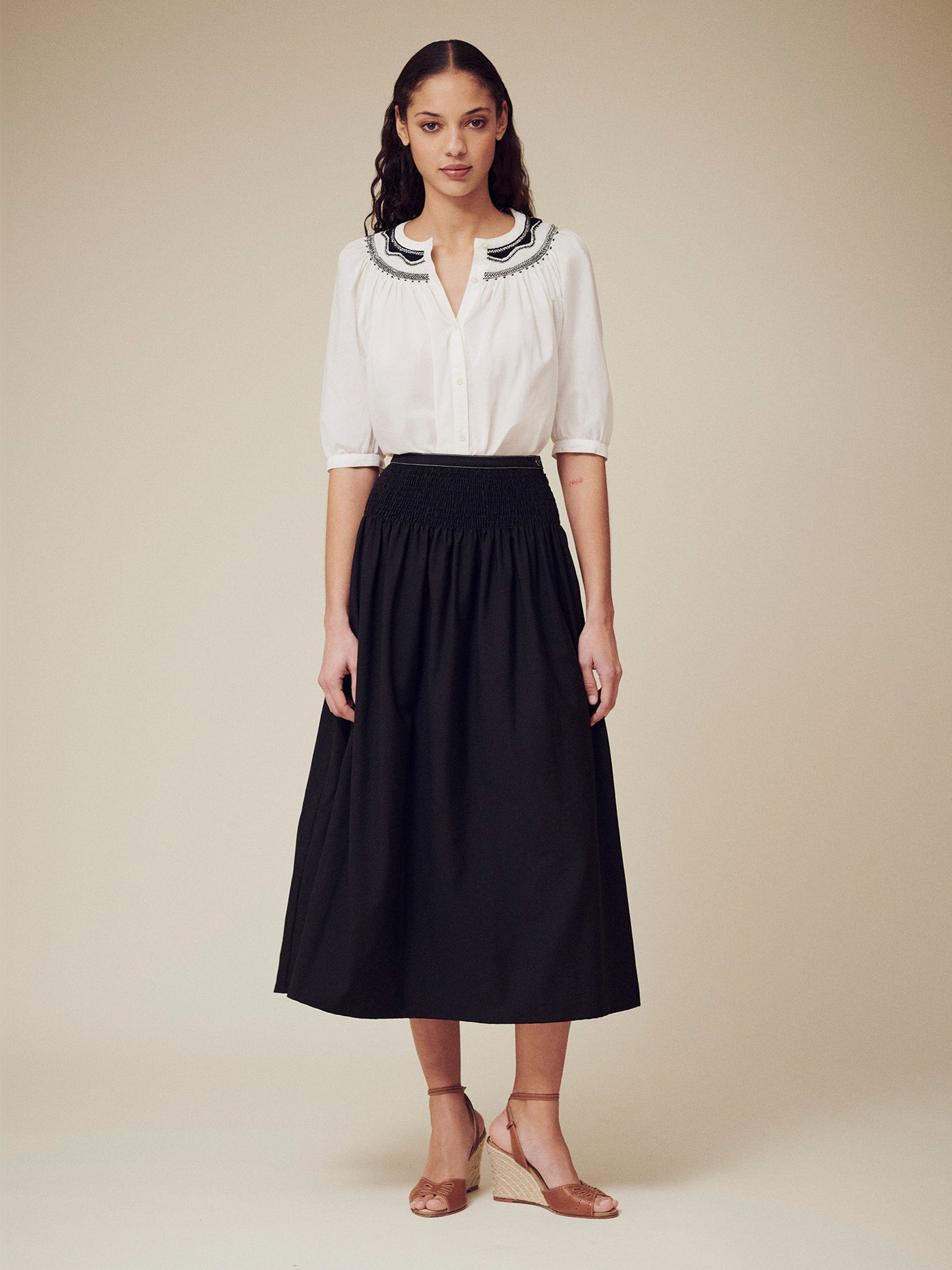 Women's summer look 2025 black skirt