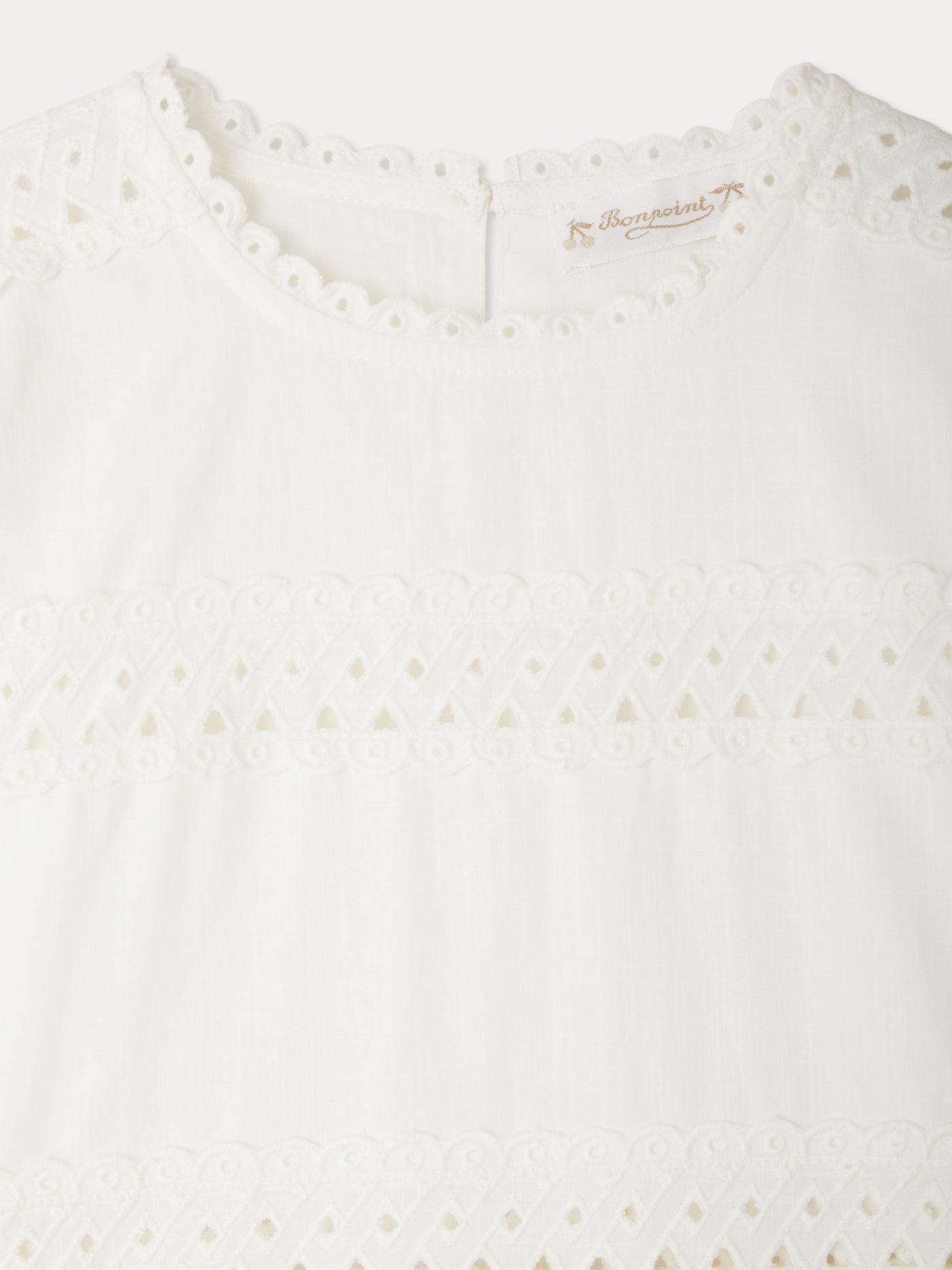 Elesa dress with crossed embroideries