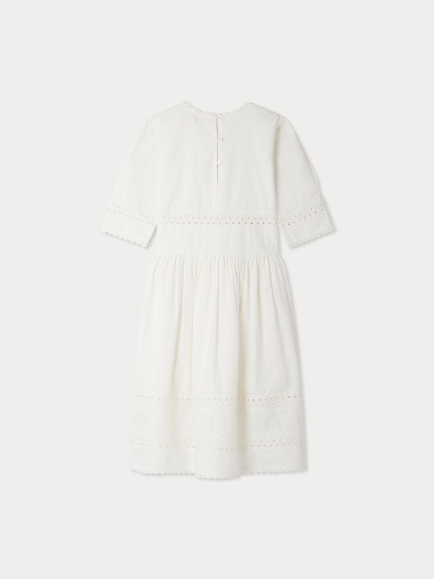 Elesa dress with crossed embroideries